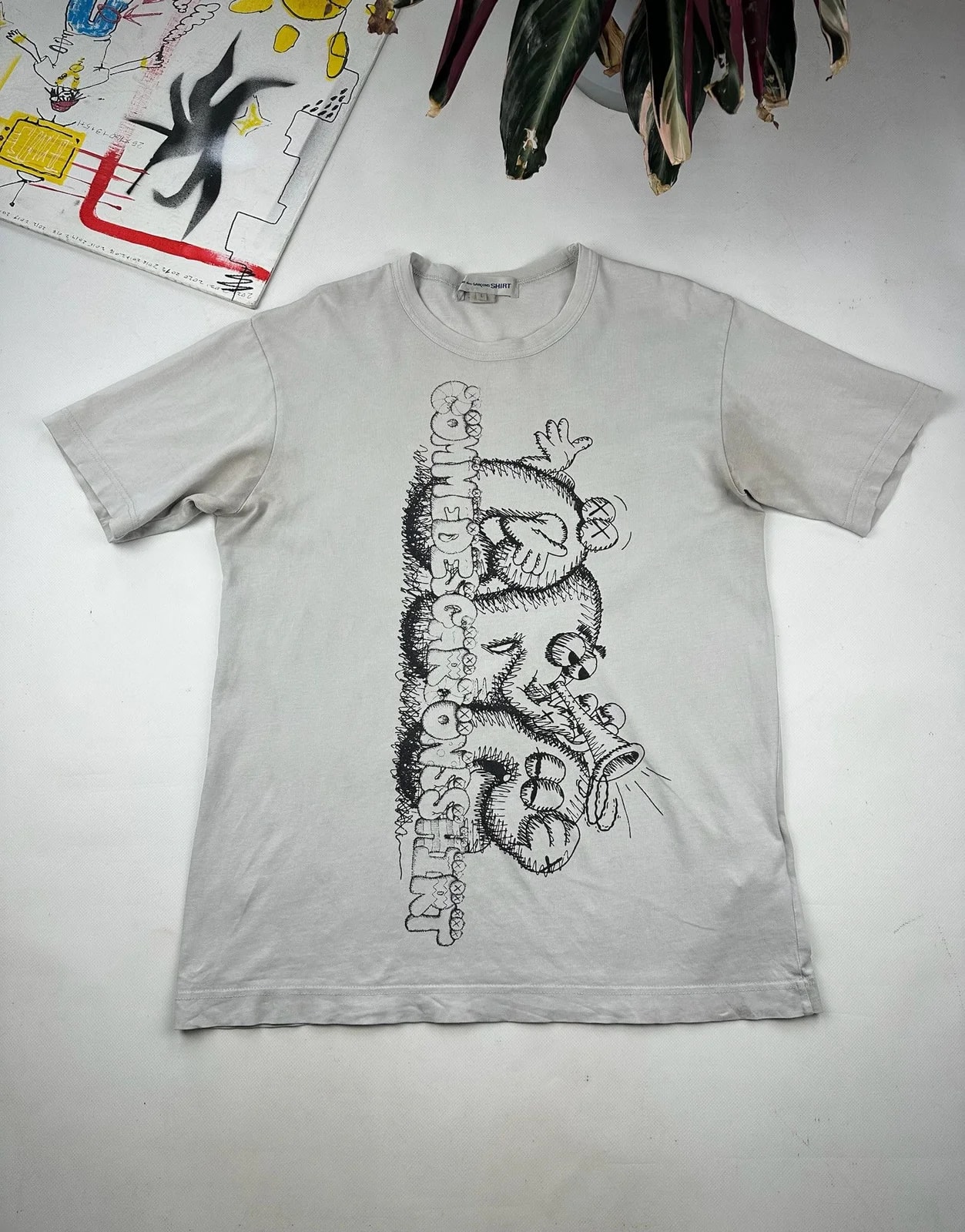 KAWS — Comme des Garcon X Kaws Shirt — streetwear — resale
