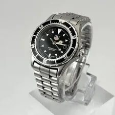 Tag Heuer — TAG Heuer Professional 973.008 Black Silver Quartz Analog Round — Watch — resale