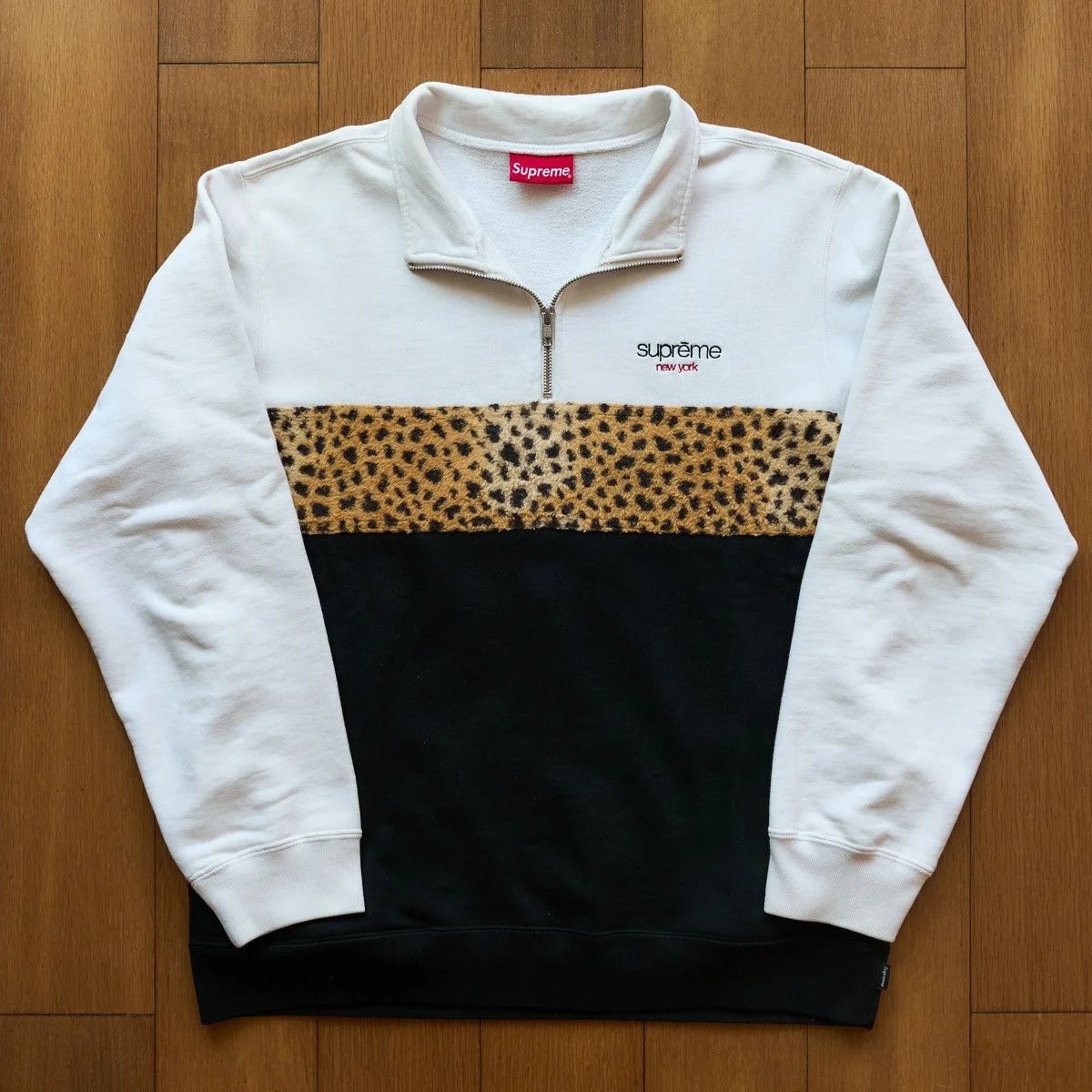 Supreme — Supreme Leopard Panel Half Zip Sweatshirt — streetwear — resale