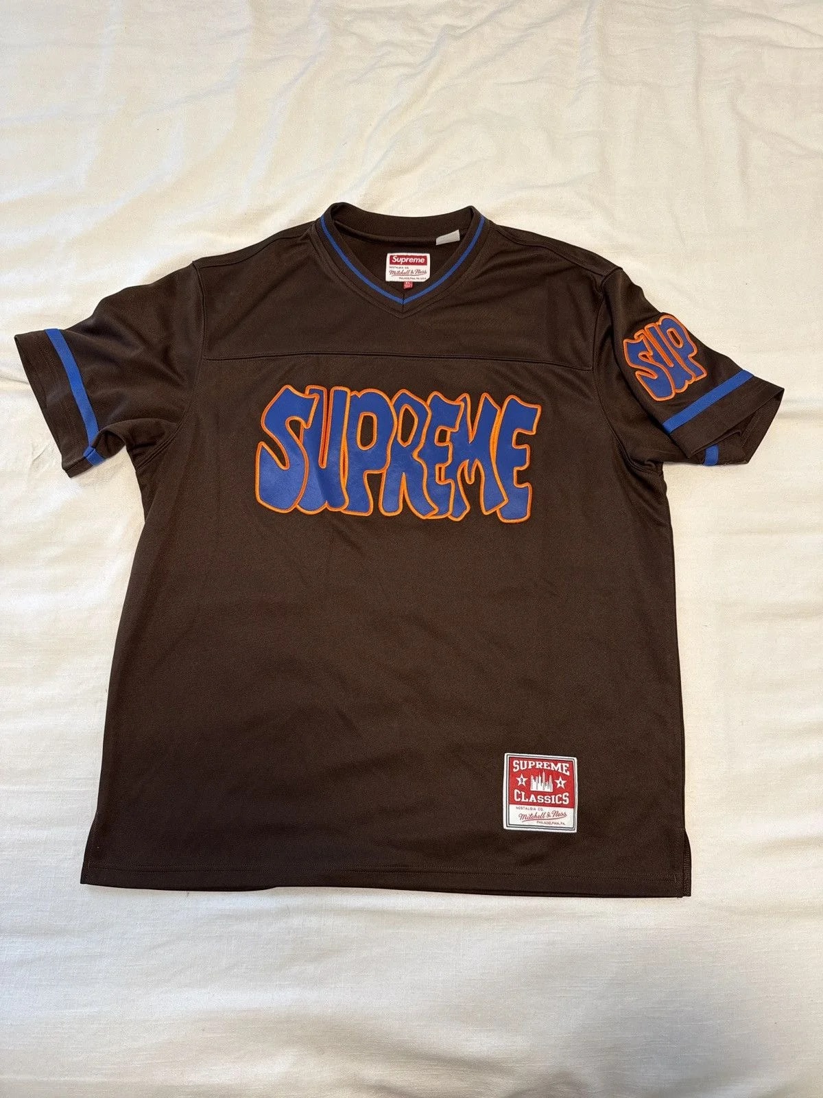 Supreme — Supreme Mitchell & Ness Football — streetwear — resale