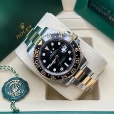 Rolex GMT-Master II Black Dial Two Tone Yellow Gold Black Ceramic Bezel Oyster 4