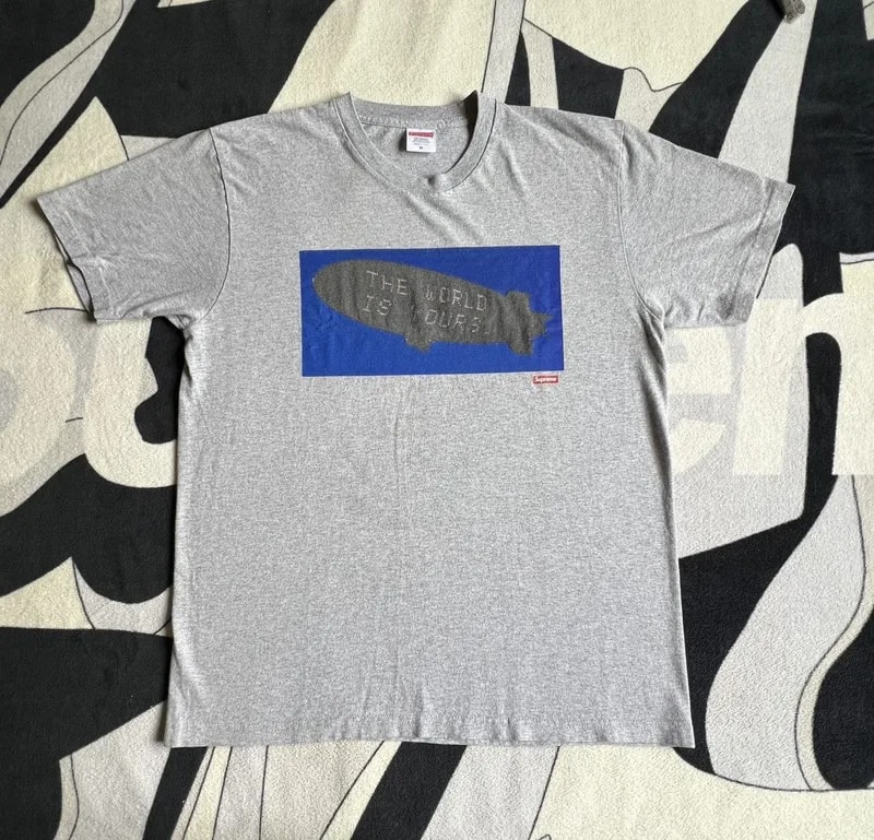 Supreme — Supreme Scarface Blimp Tee - Heather — streetwear — resale