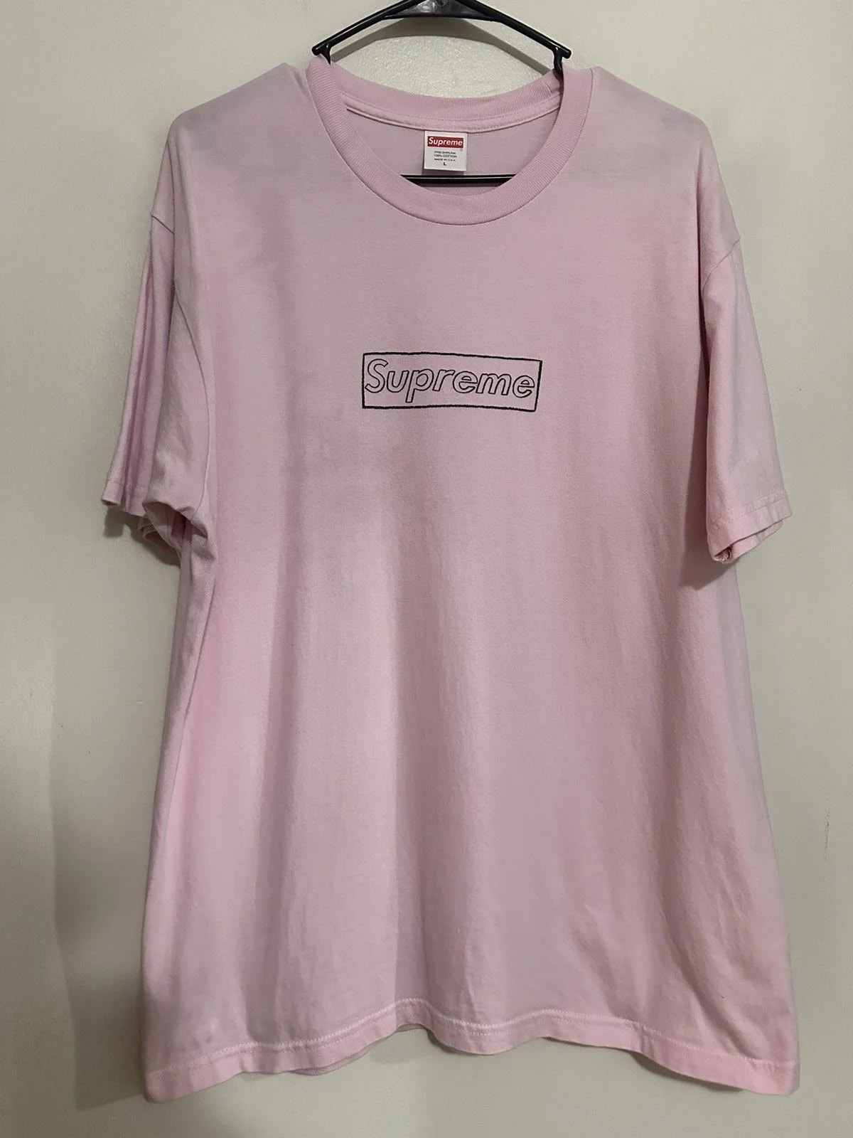 Supreme — Supreme Kaws Logo Tee — streetwear — resale