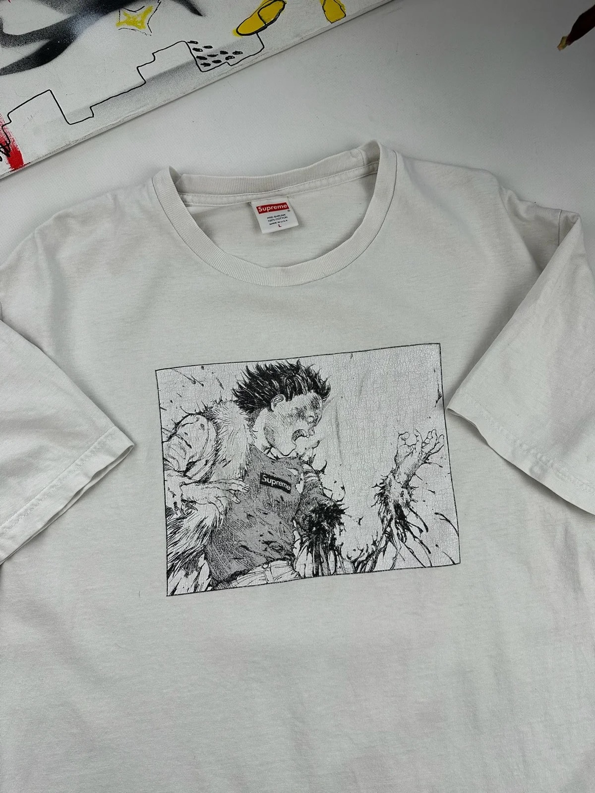 Supreme — Supreme Akira Arm Tee — streetwear — resale