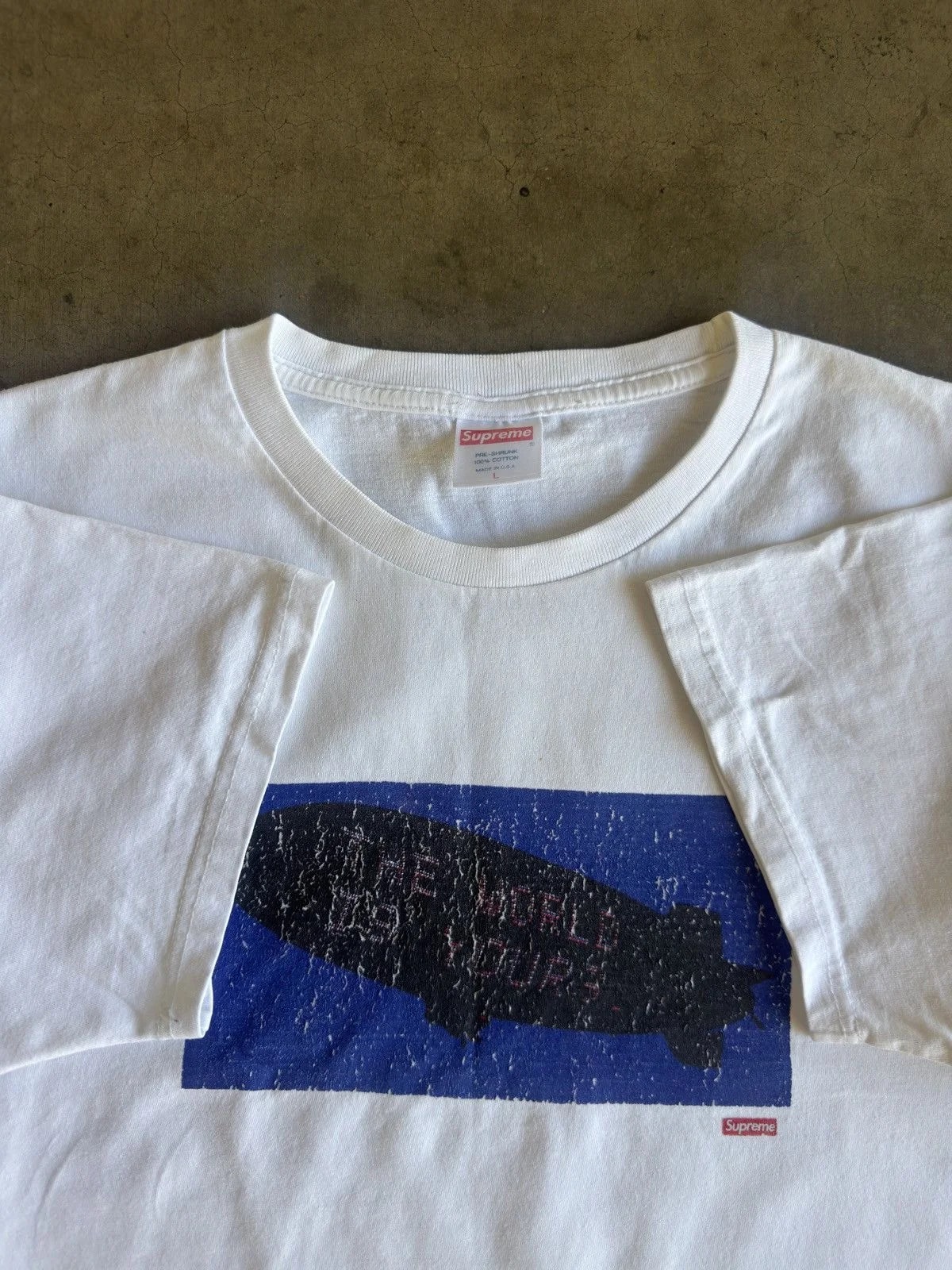 Supreme — Faded Supreme “The World Is Yours” Graphic X Scarface Tee — streetwear — resale