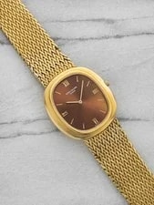 1970s Patek Philippe Ellipse 3589/1 18K YG Red Sunburst Dial Auto 33mm 2