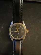 Rolex — Rolex Oyster Perpetual Automatic Black Dial Fluted Gold Bezel Leather Strap — Watch — resale