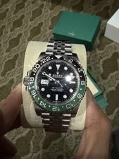 Rolex — Rolex GMT-Master II Left-Hand Black Dial Green/Black Bezel Jubilee Box Papers — Watch — resale