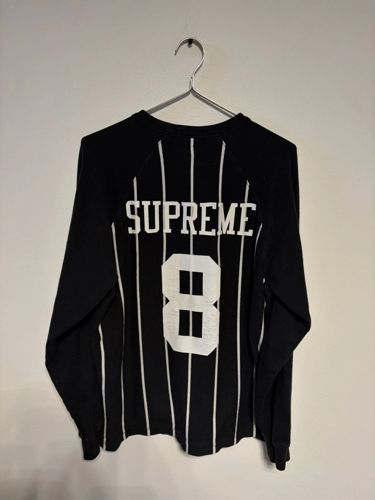 Supreme — Supreme Stripe Raglan L/S Top — streetwear — resale