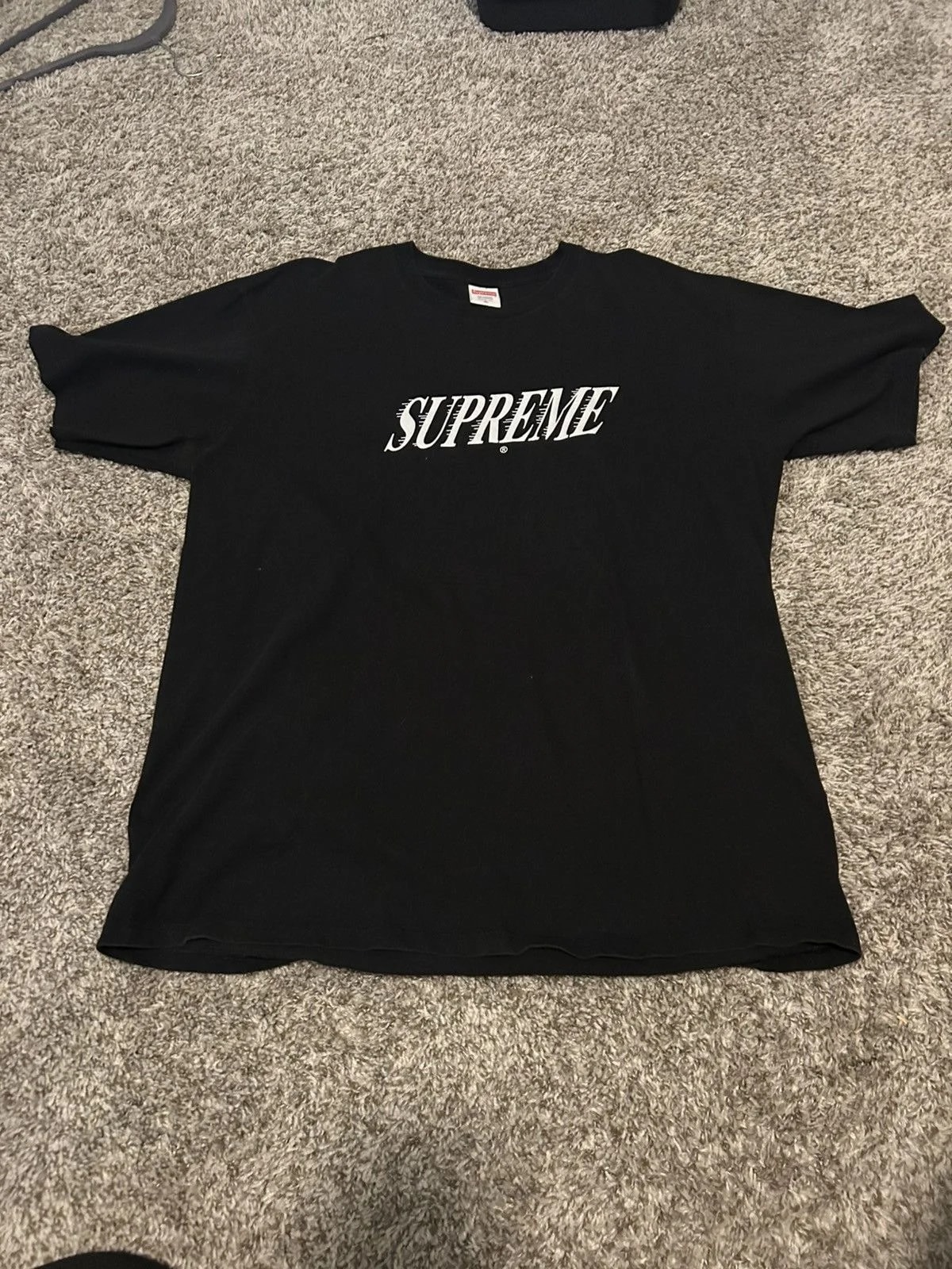 Supreme — Supreme Spellout Tee — streetwear — resale