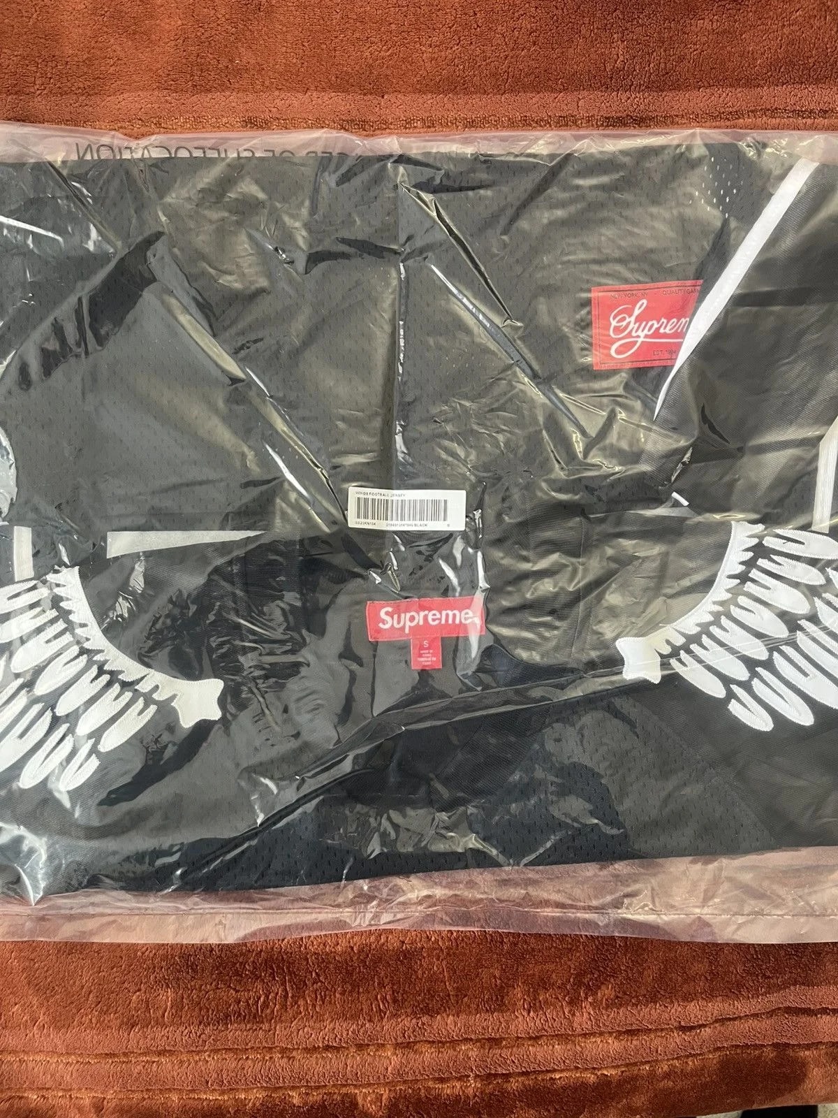 Supreme — Supreme Wings Football S Small in Hand — streetwear — resale