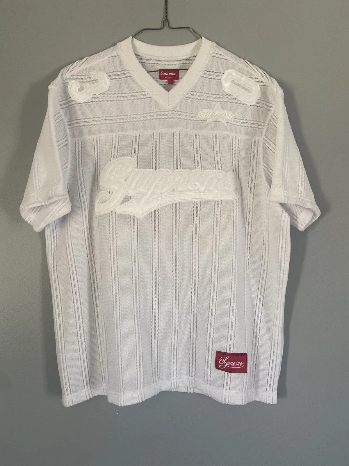 Supreme — Supreme Stripe Football Top — streetwear — resale