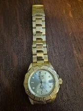Invicta Diver Gold-Tone Automatic 300m Date Exhibition Caseback. 2