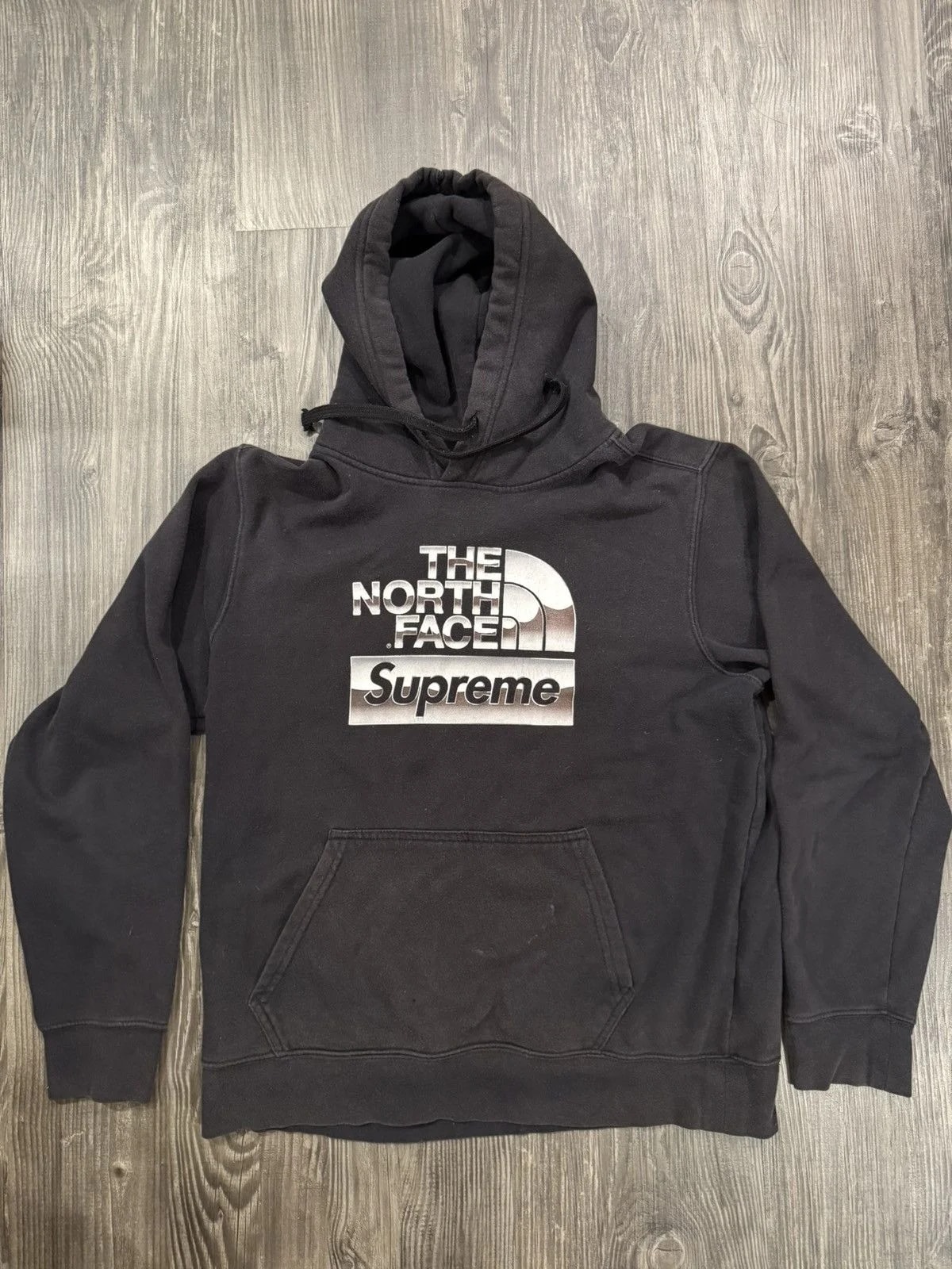 Supreme/The North Face Metallic Logo Hooded Sweatshirt — streetwear — resale