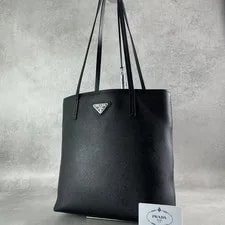 Prada — Prada Triangle Logo Plaque — Handbag — resale