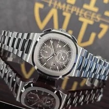 Patek Philippe — Patek Philippe Nautilus 40.5MM Travel Time 5990/1A-001 Stainless Steel B&P — Watch — resale