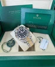Rolex — Rolex GMT-Master II 126713GRNR Gold and Silver Jubilee Bracelet With Black Bezel — Watch — resale
