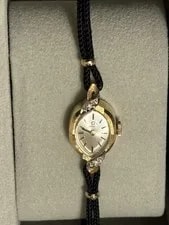 Omega — Omega Gold Oval Dress Black Fabric Strap Analog Baton Indexes — Watch — resale