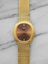 Patek Philippe — 1970s Patek Philippe Ellipse 3589/1 18K YG Red Sunburst Dial Auto 33mm — Watch — resale
