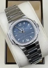 Patek Philippe — 7018/1A Patek Philippe Nautilus Blue Tinted Mother of Pearl Dial Diamond — Watch — resale