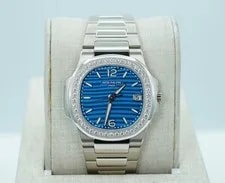 Patek Philippe — Patek Philippe Nautilus 7010/1G White Gold Light Blue Dial Diamond Bezel 2025 — Watch — resale