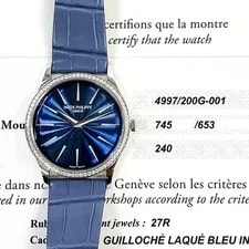 Patek Philippe — 2022 Patek Philippe Calatrava 4997/200G-001, 35mm, White Gold, Blue Dial, Box... — Watch — resale