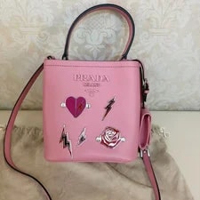 Prada — 20% OFF Prada Bucket Top Handle Heart Lightning Enamel Badge — Handbag — resale