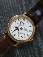 Patek Philippe — 41783: Patek Philippe 18k Yellow Gold Moonphase Ref. 5015J, Box and Papers 1996 — Watch — resale